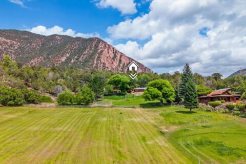 Colorado Log Home on 3.75 Acres For Sale with Pond, Orchard